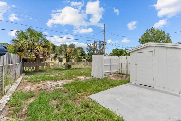 a view of a back yard of the house