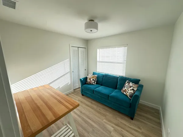 a living room with furniture and a window