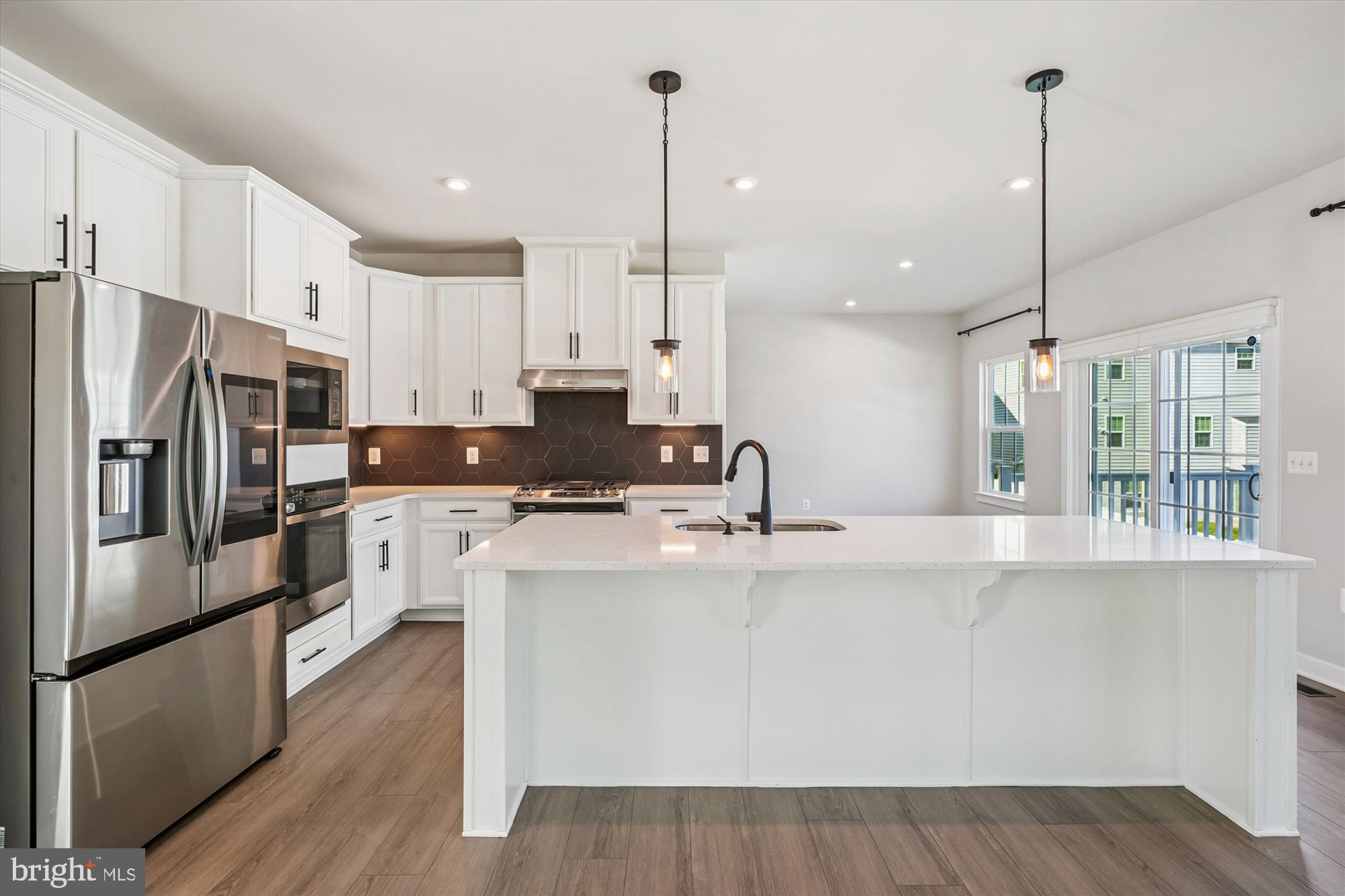 105 Driscoll Lane Stafford, VA 22554 - Photo 13 of 69 a kitchen with stainless steel appliances granite countertop a refrigerator a sink a stove and a refrigerator