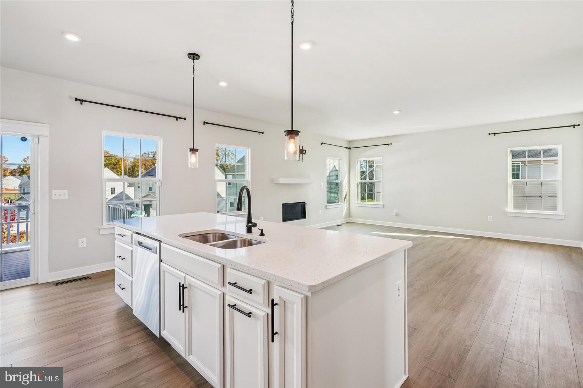 105 Driscoll Lane Stafford, VA 22554 - Photo 15 of 69 a kitchen with stainless steel appliances granite countertop a sink a oven a stove and a wooden floors