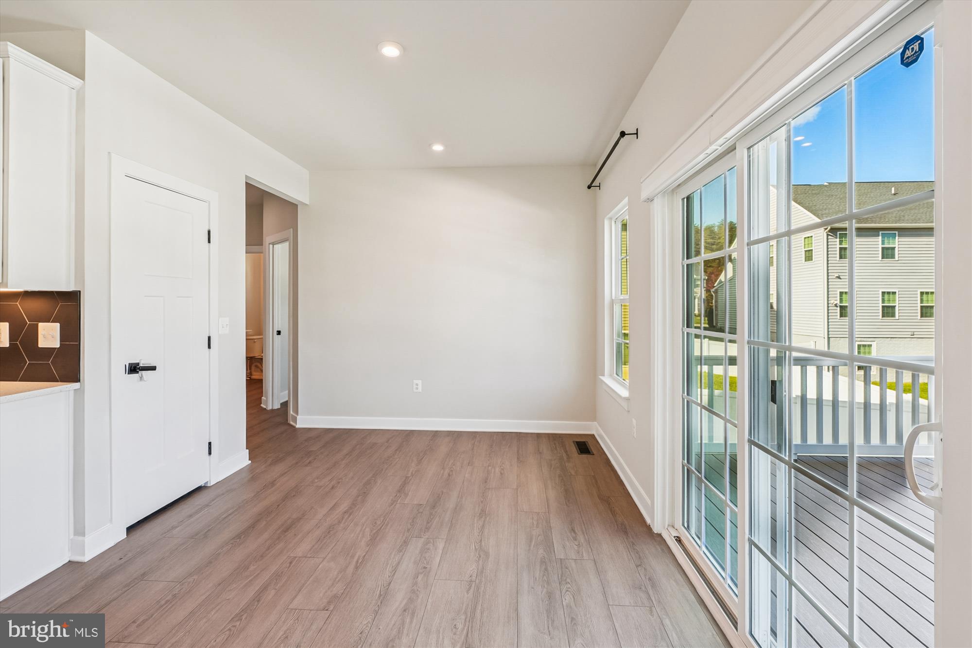 105 Driscoll Lane Stafford, VA 22554 - Photo 16 of 69 a view of a hallway with wooden floor and a bathroom