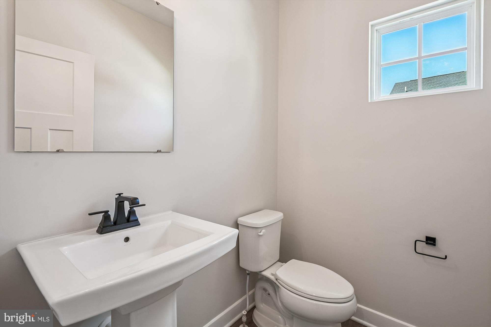 105 Driscoll Lane Stafford, VA 22554 - Photo 20 of 69 a white toilet sitting next to a bathroom sink
