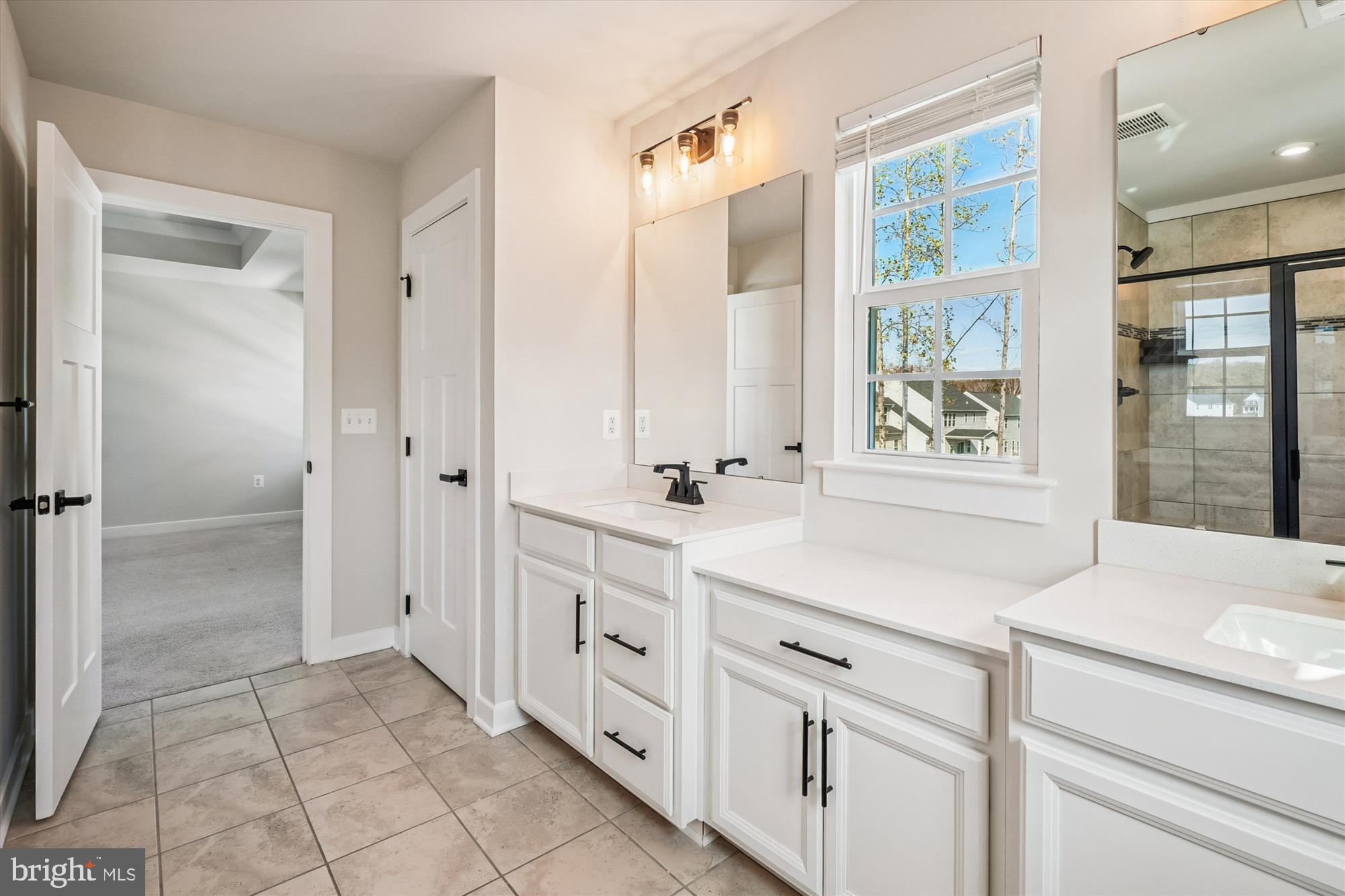105 Driscoll Lane Stafford, VA 22554 - Photo 26 of 69 a spacious bathroom with a shower sink and mirror