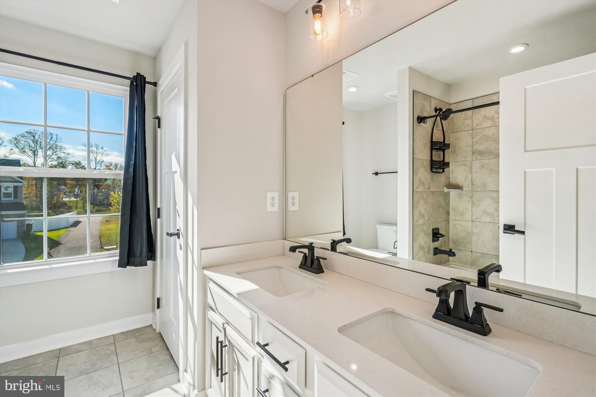 105 Driscoll Lane Stafford, VA 22554 - Photo 38 of 69 a bathroom with a sink tub and a mirror