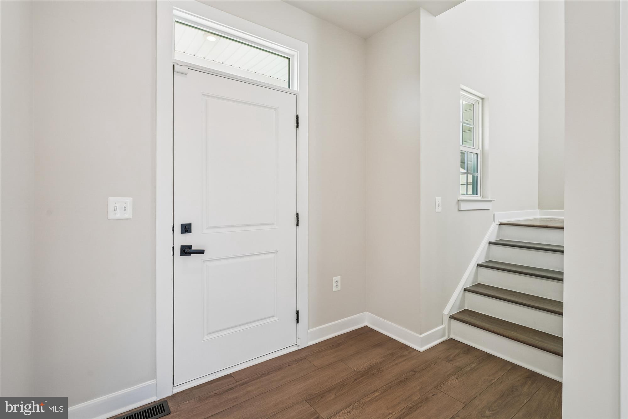 105 Driscoll Lane Stafford, VA 22554 - Photo 4 of 69 an empty room with wooden floor and closet
