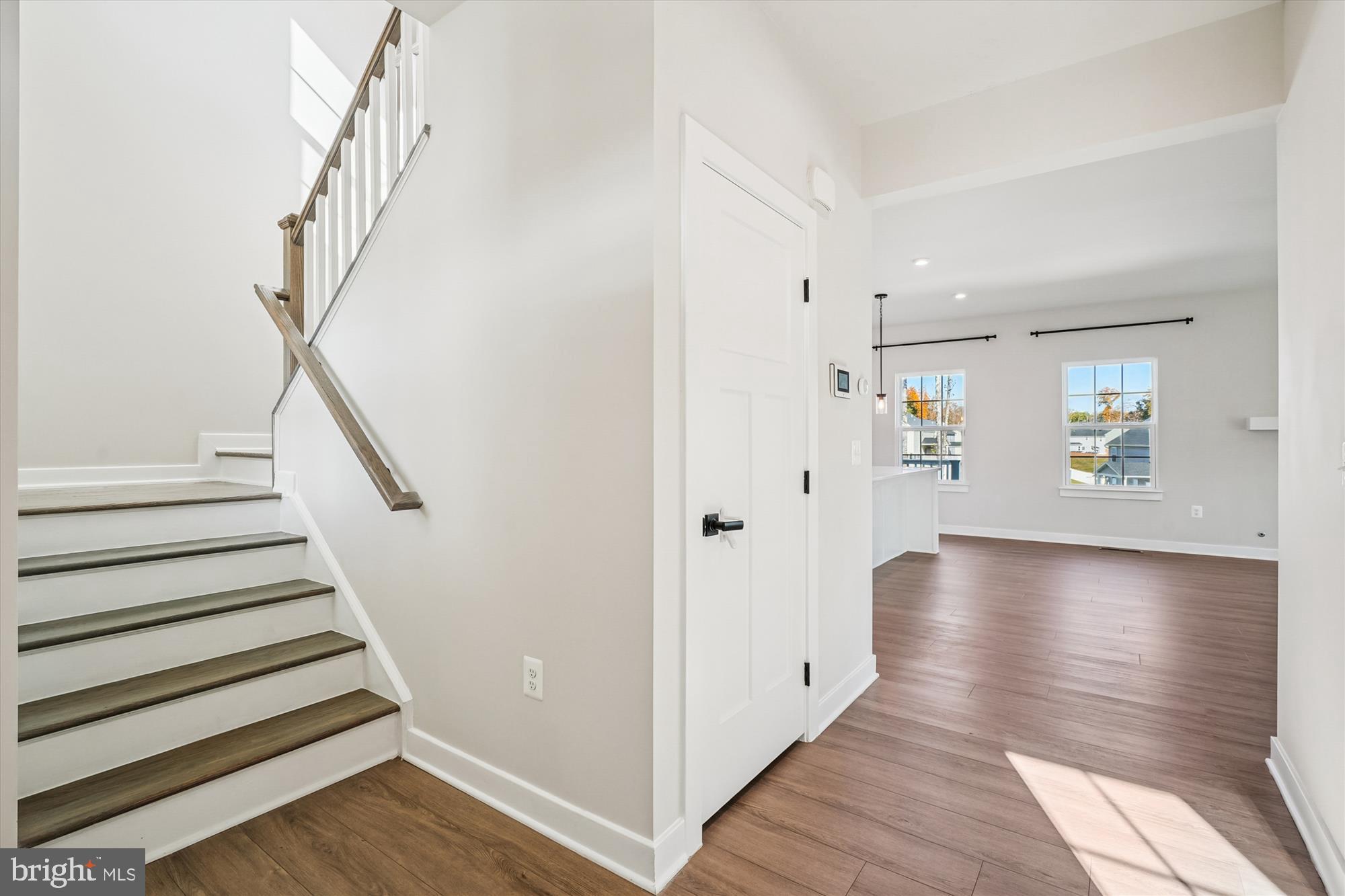 105 Driscoll Lane Stafford, VA 22554 - Photo 5 of 69 a view of a hallway with wooden floor and staircase