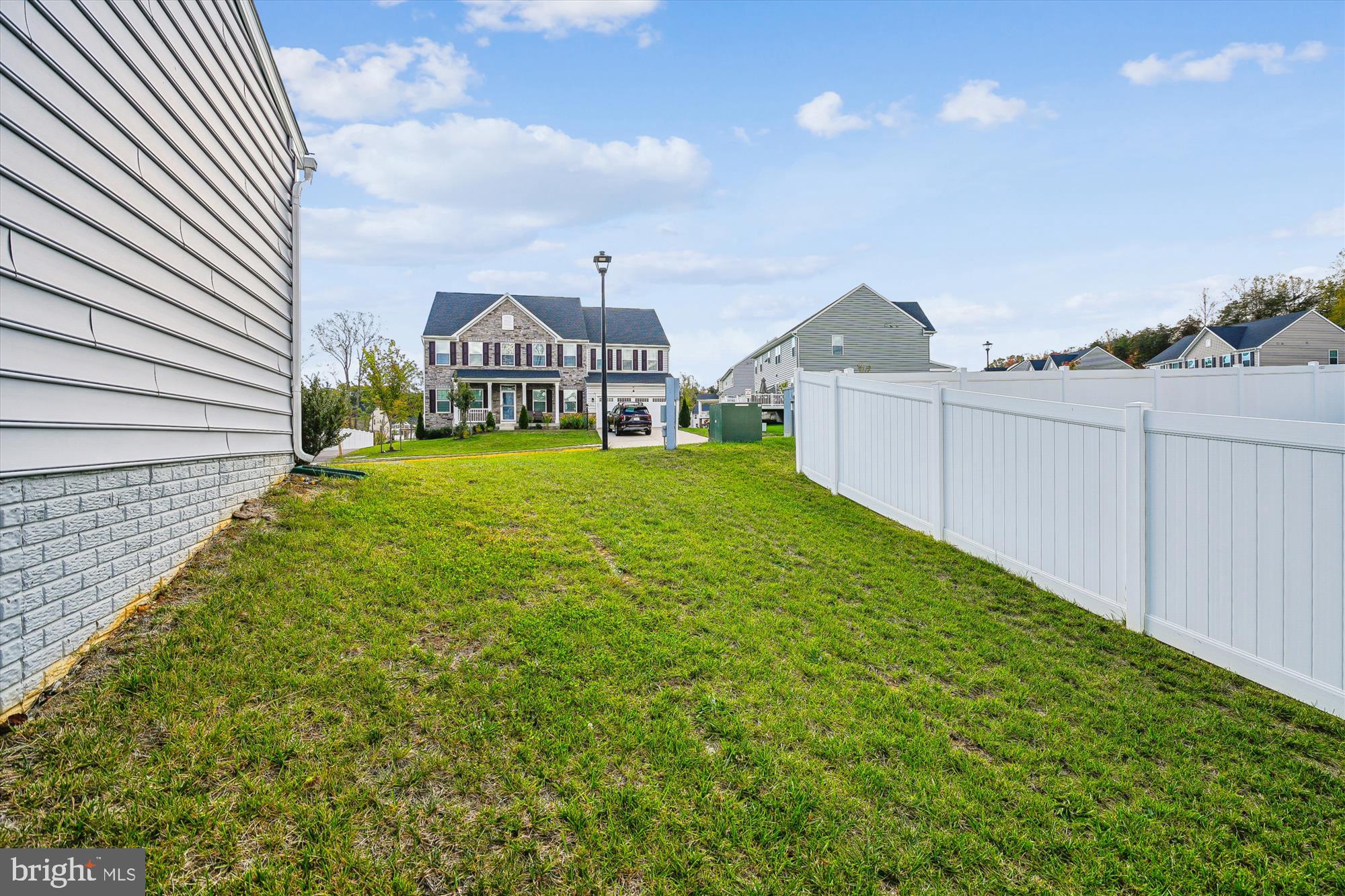 105 Driscoll Lane Stafford, VA 22554 - Photo 64 of 69 a view of a big yard with potted plants by side of it