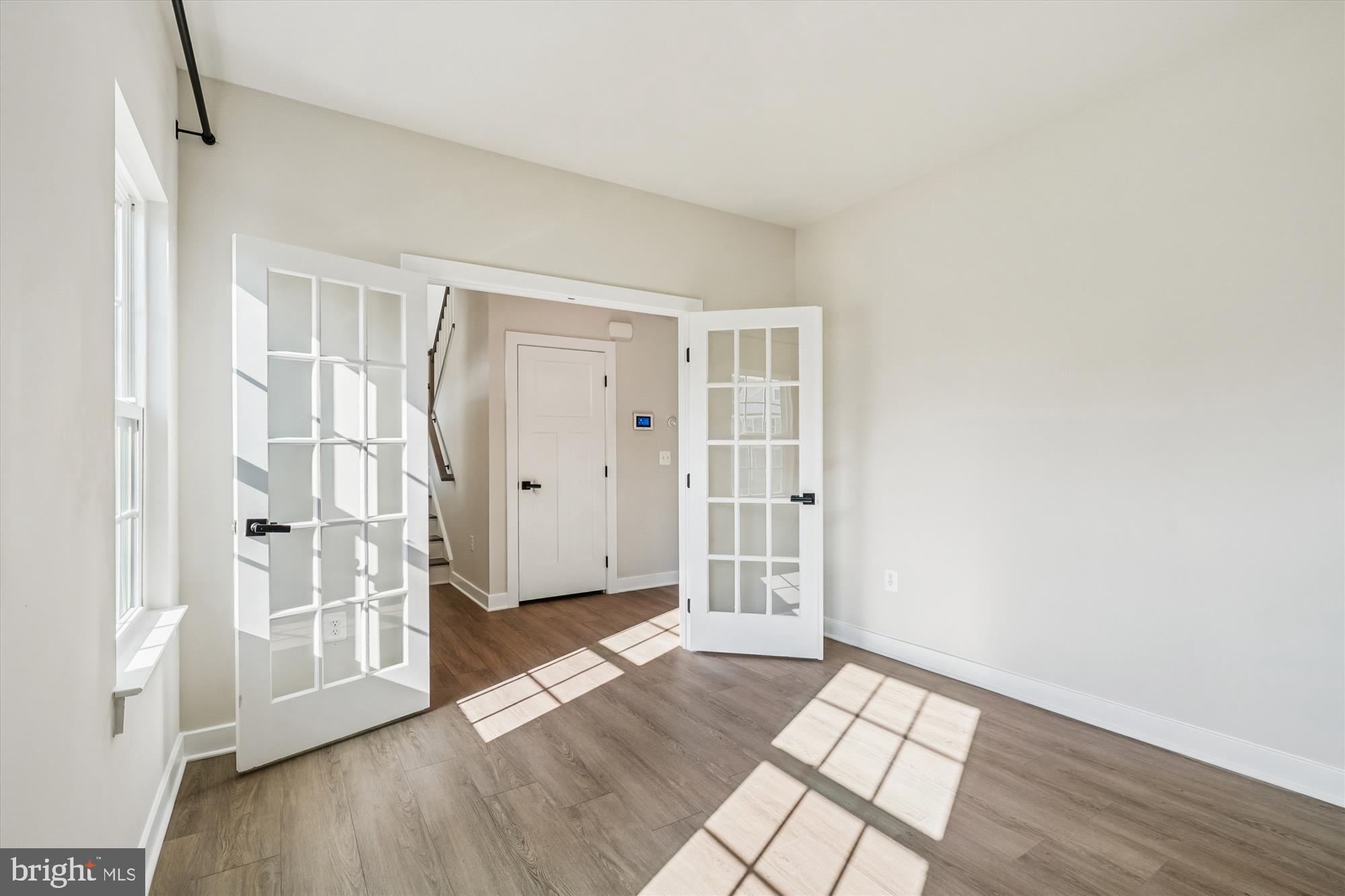 105 Driscoll Lane Stafford, VA 22554 - Photo 8 of 69 an empty room with wooden floor and a window