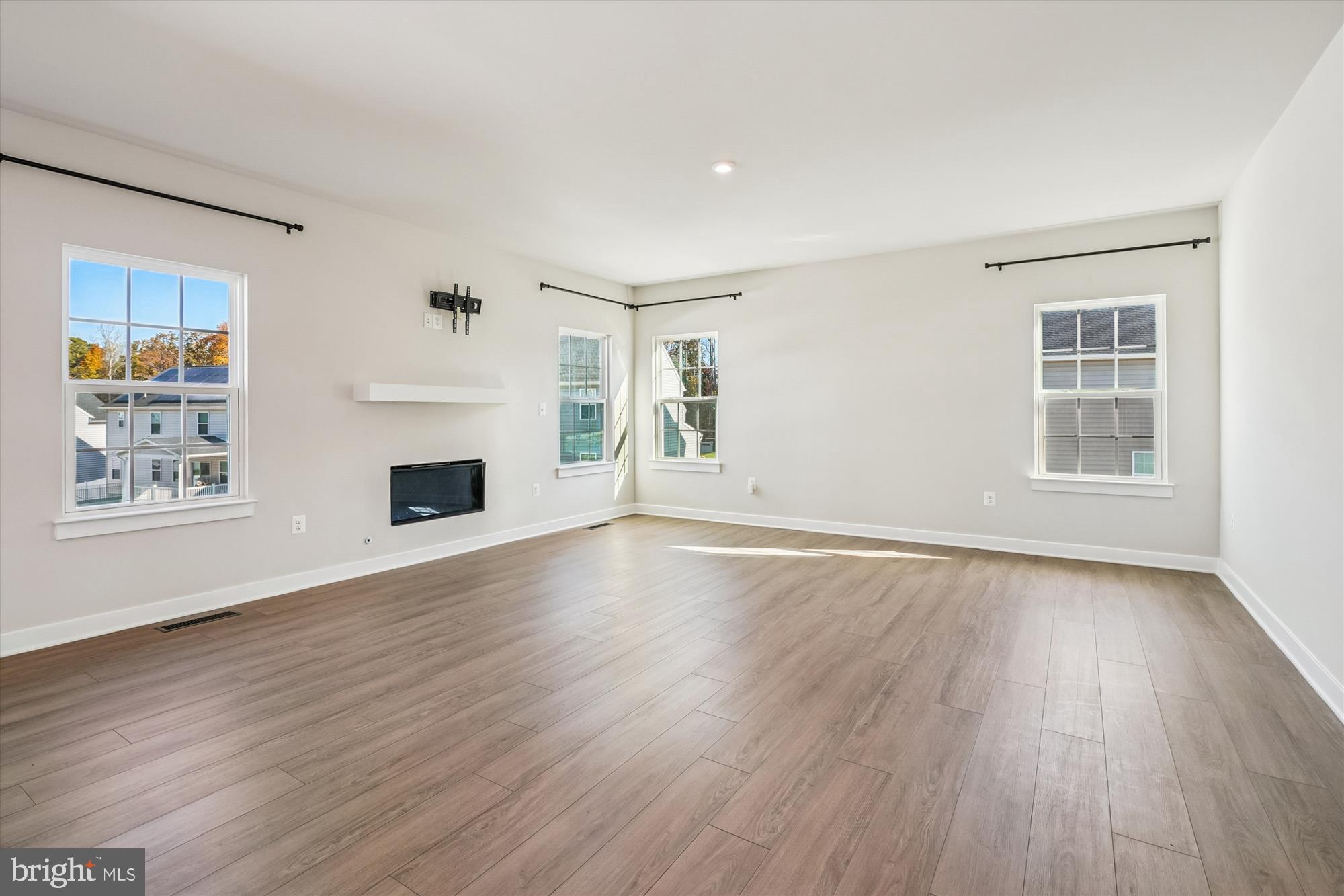 105 Driscoll Lane Stafford, VA 22554 - Photo 9 of 69 an empty room with wooden floor and windows