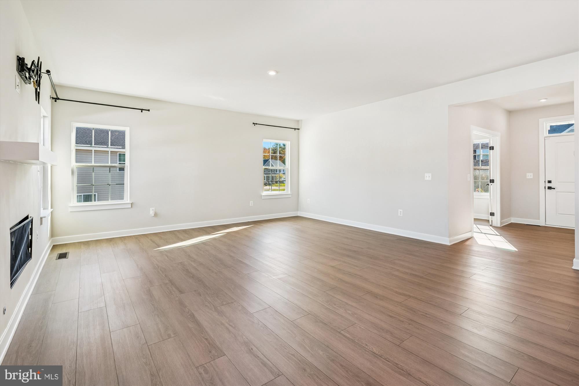 105 Driscoll Lane Stafford, VA 22554 - Photo 10 of 69 an empty room with wooden floor and windows
