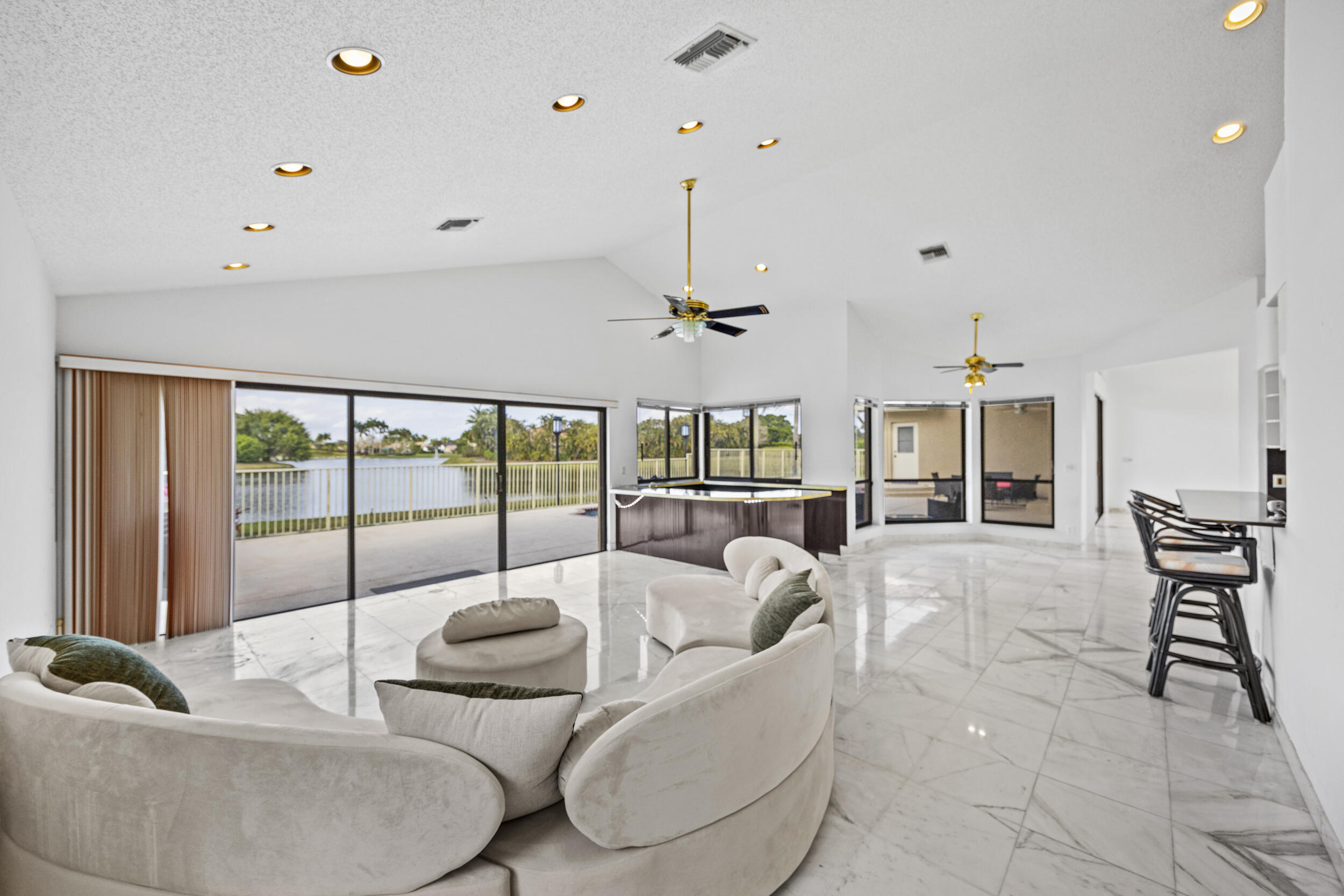10747 Stonebridge Boulevard Boca Raton, FL 33498 - Photo 20 of 75 a living room with furniture and a large window
