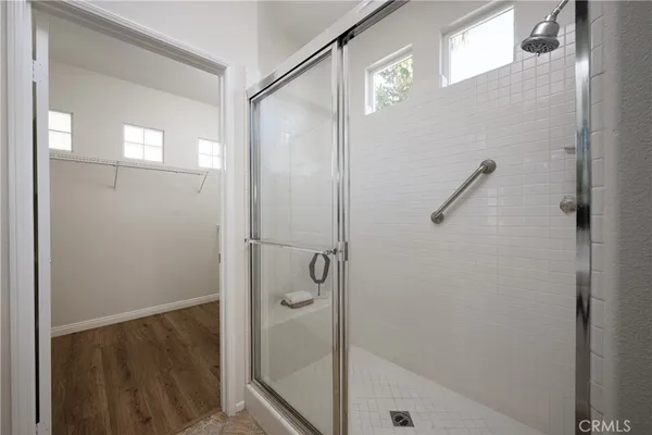 a bathroom with a glass shower door
