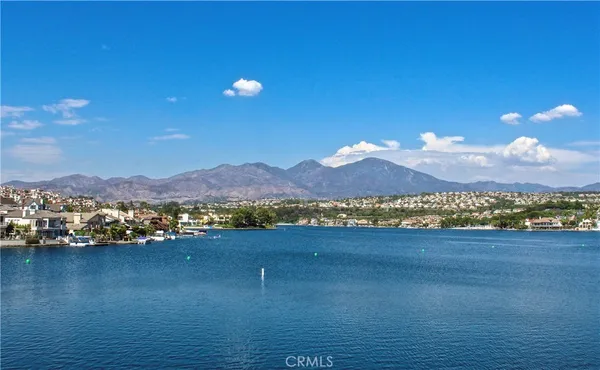 a view of an ocean and a mountain