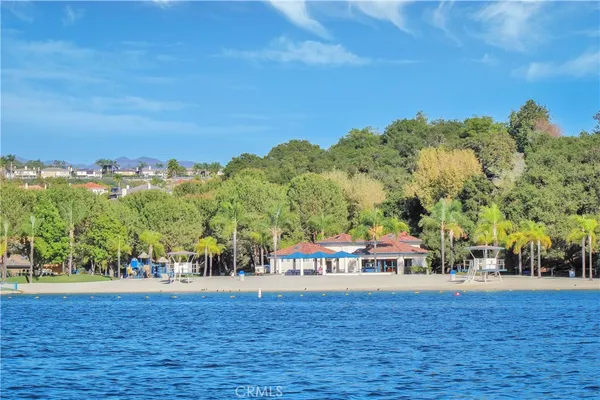 a view of swimming pool and trees in the background