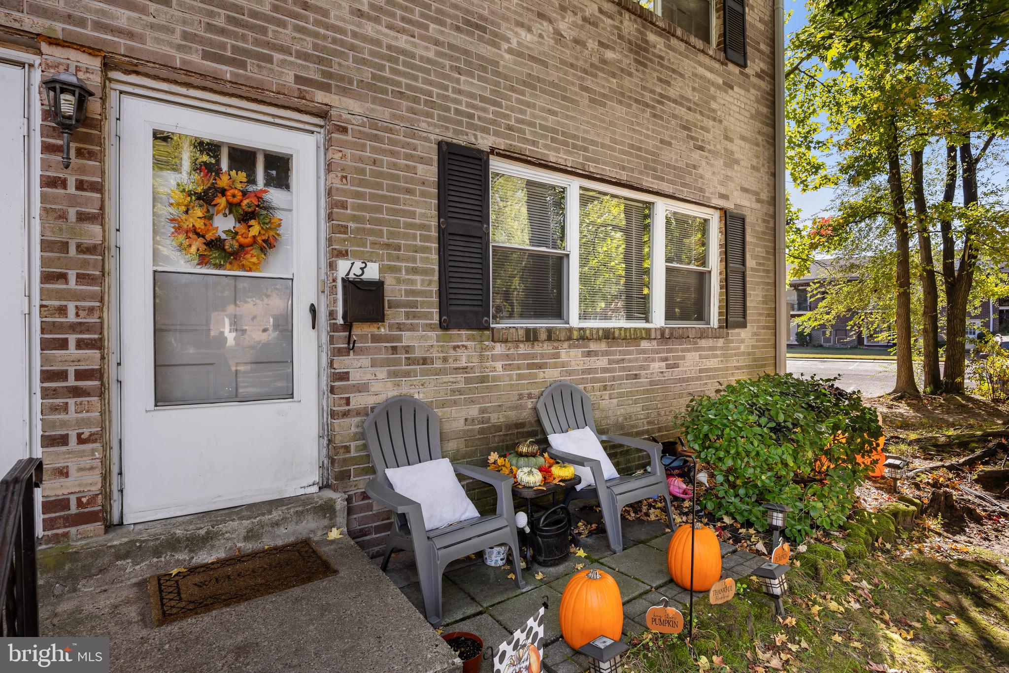 1294 Cooper Street, Unit E13 Edgewater Park, NJ 08010 - Photo 3 of 15 a view of a house with backyard and sitting area