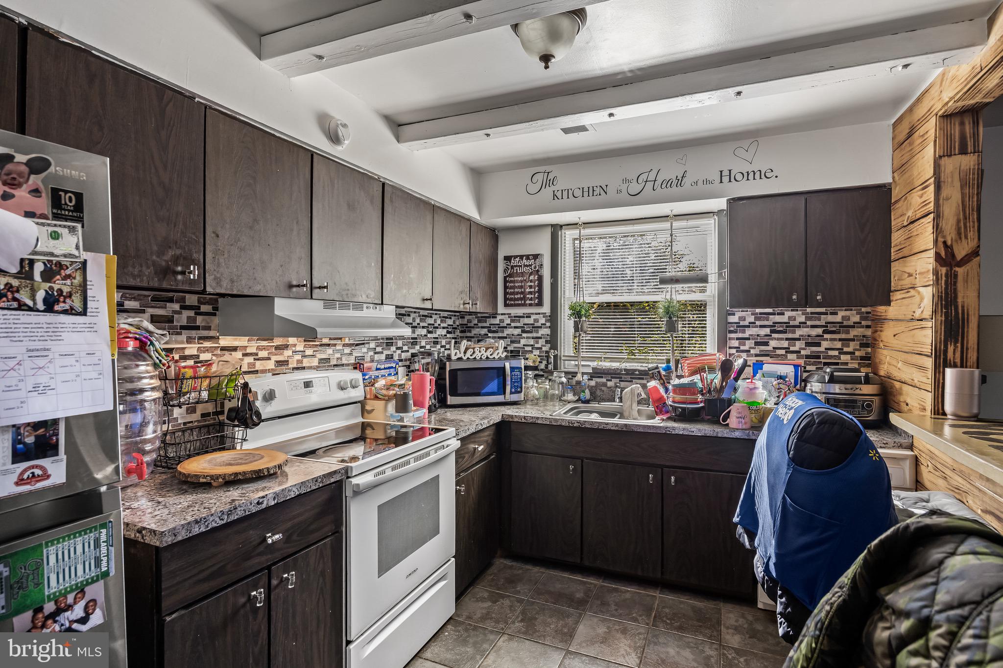 1294 Cooper Street, Unit E13 Edgewater Park, NJ 08010 - Photo 8 of 15 a kitchen with lots of appliances and cabinets