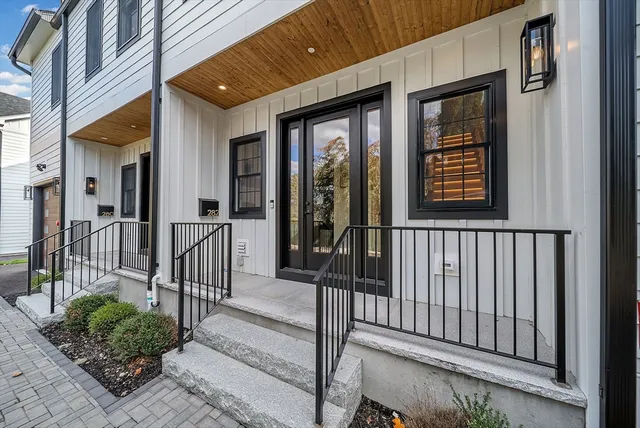 a view of a brick house with a large window