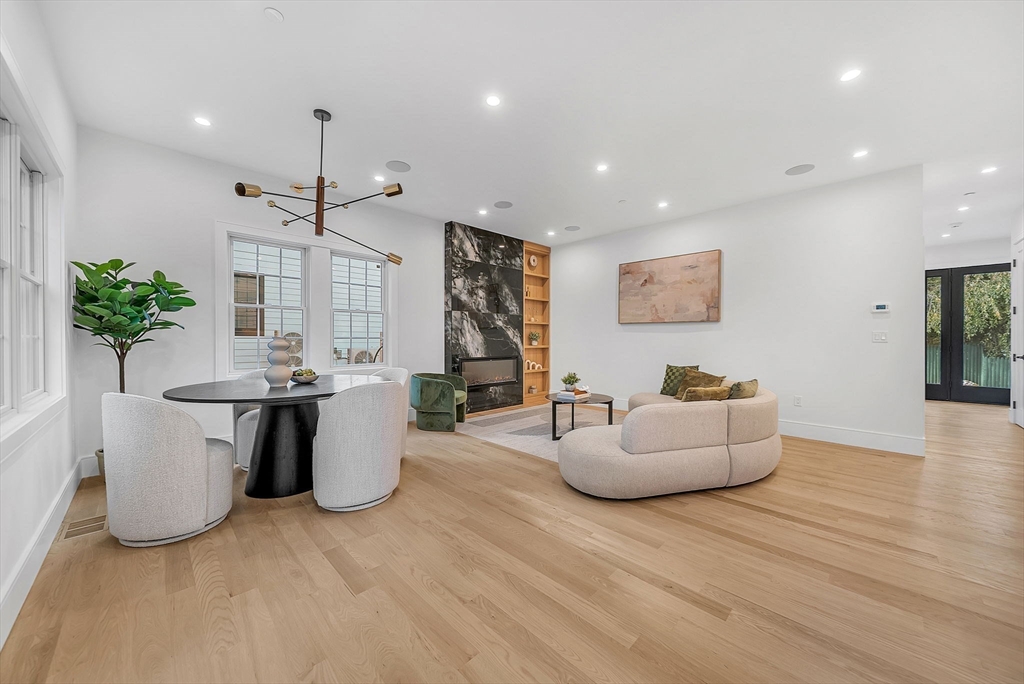 284 Nevada Street, Unit 284 Newton, MA 02460 - Photo 11 of 29 a living room with furniture and a potted plant