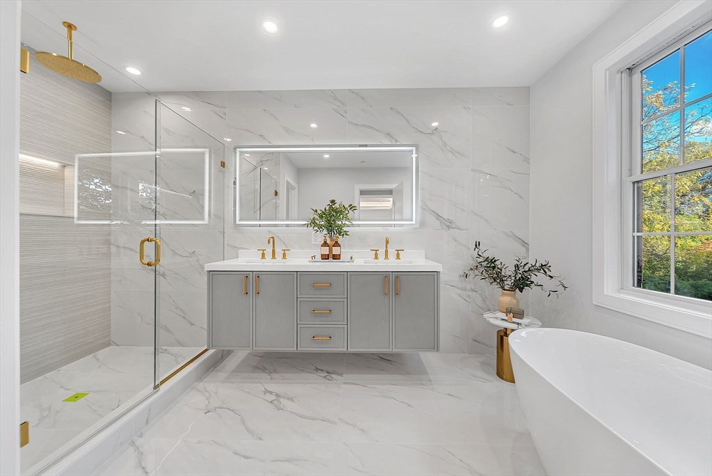284 Nevada Street, Unit 284 Newton, MA 02460 - Photo 13 of 29 a bathroom with a bathtub sink and mirror