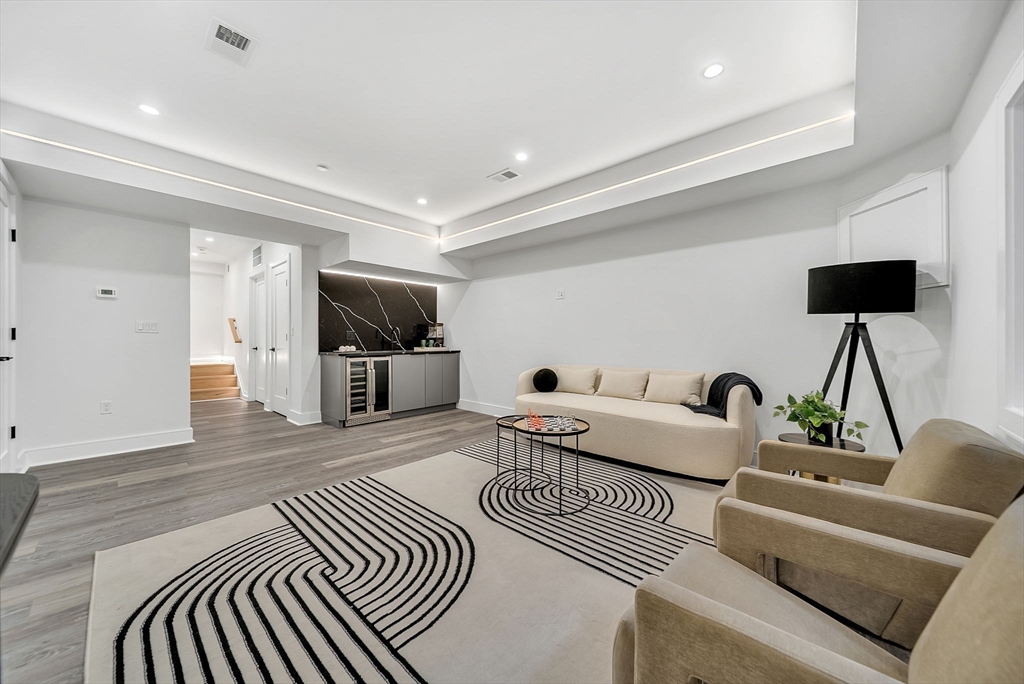 284 Nevada Street, Unit 284 Newton, MA 02460 - Photo 21 of 29 a living room with furniture and a flat screen tv