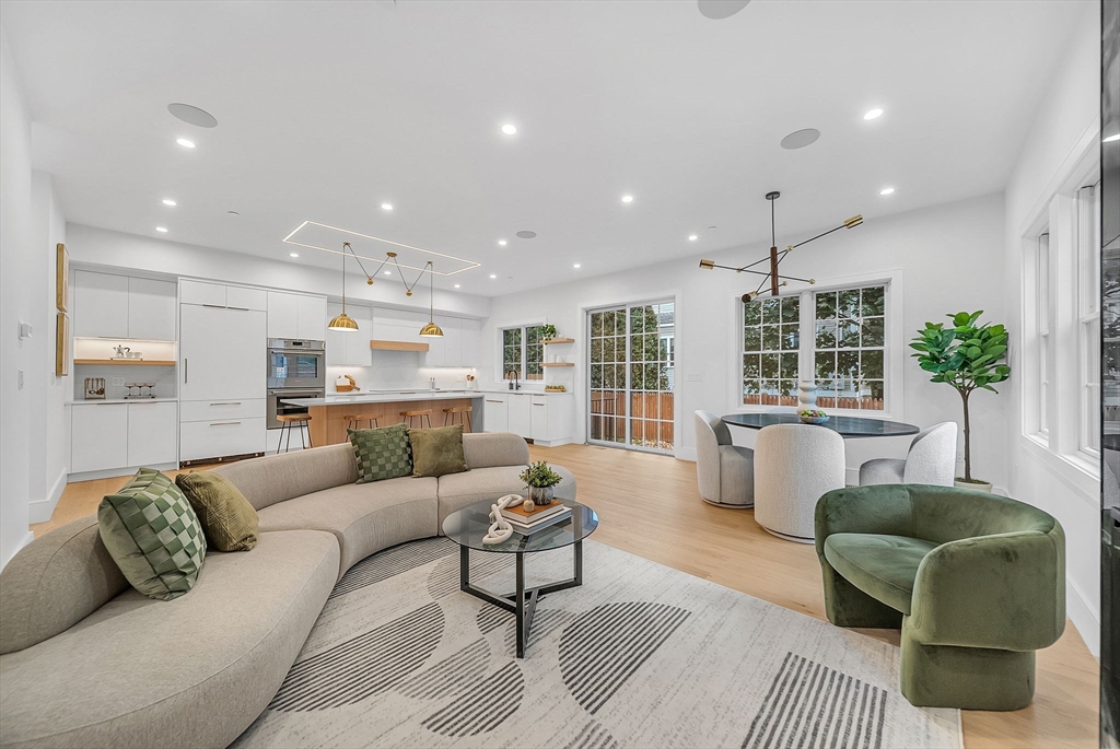 284 Nevada Street, Unit 284 Newton, MA 02460 - Photo 6 of 29 a living room with furniture and a large window