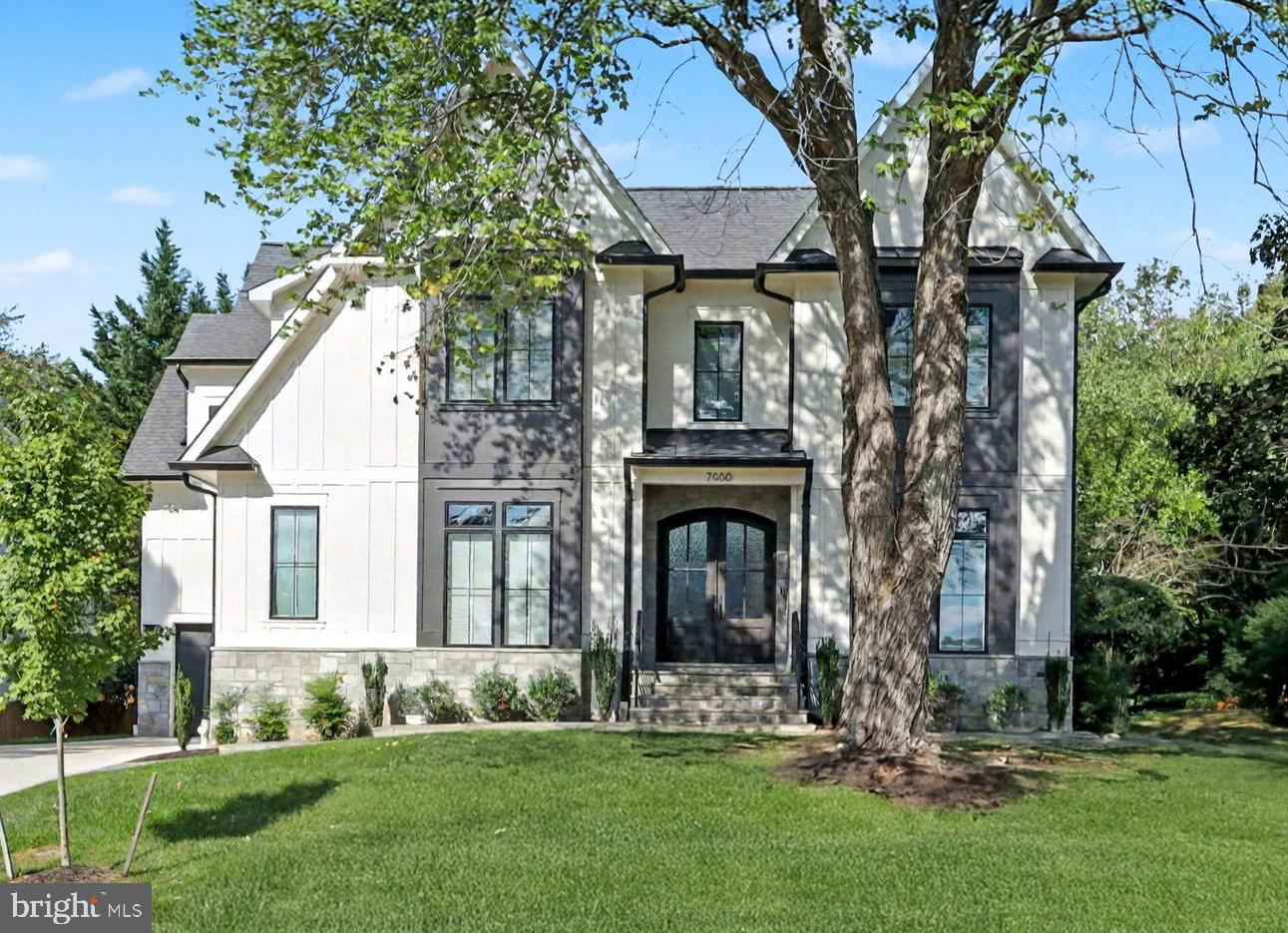 7000 Hector Road McLean, VA 22101 - Photo 1 of 50 a front view of a house with a garden and trees