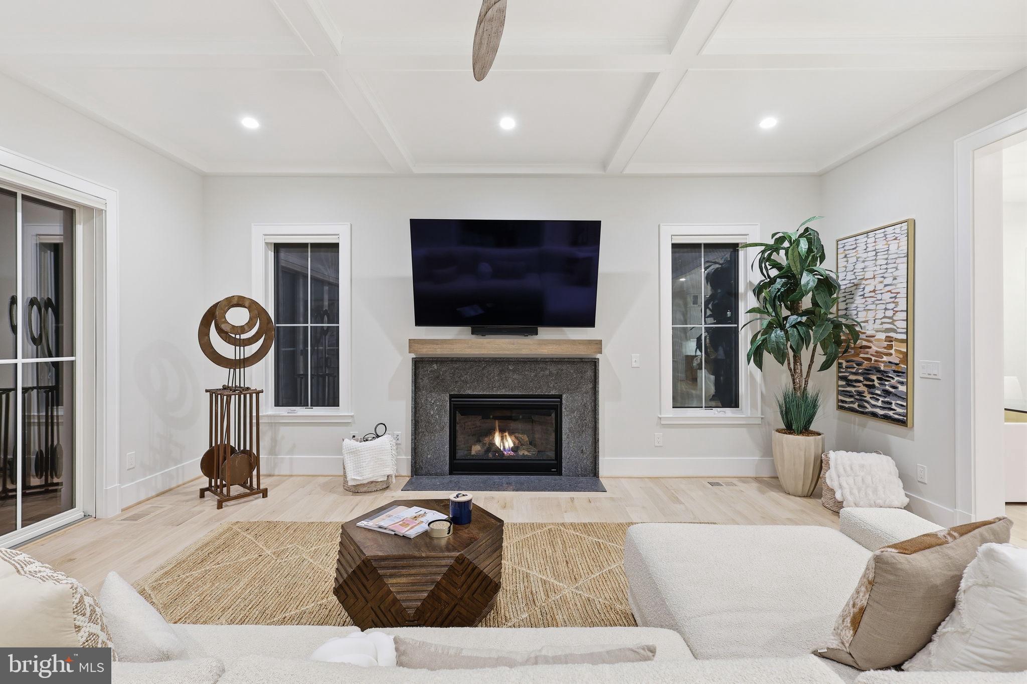 7000 Hector Road McLean, VA 22101 - Photo 13 of 50 a living room with furniture a flat screen tv and a fireplace