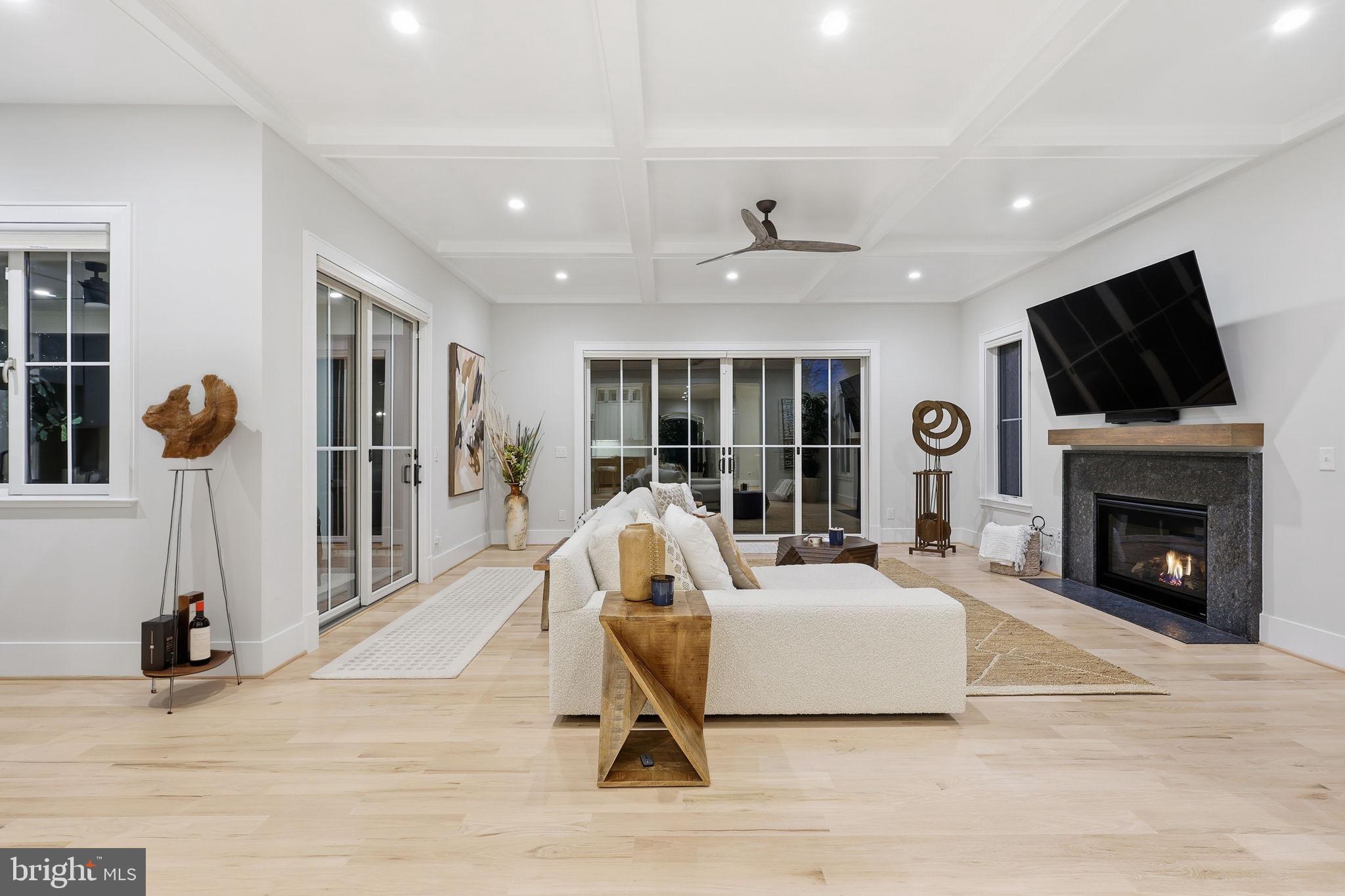 7000 Hector Road McLean, VA 22101 - Photo 14 of 50 a living room with furniture a fireplace and a flat screen tv
