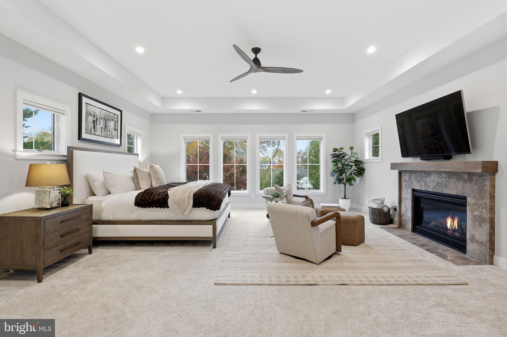 7000 Hector Road McLean, VA 22101 - Photo 19 of 50 a living room with furniture a flat screen tv and a fireplace