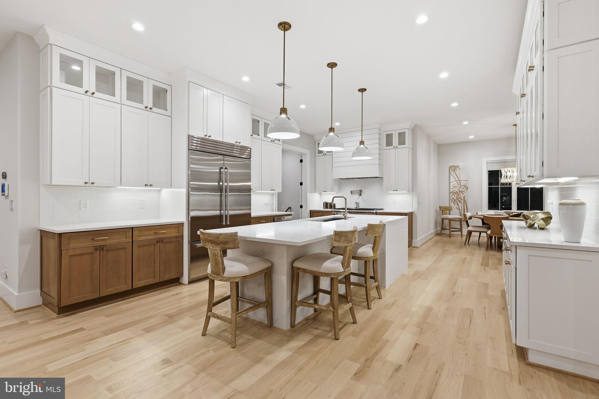 7000 Hector Road McLean, VA 22101 - Photo 2 of 50 a large kitchen with a table and chairs
