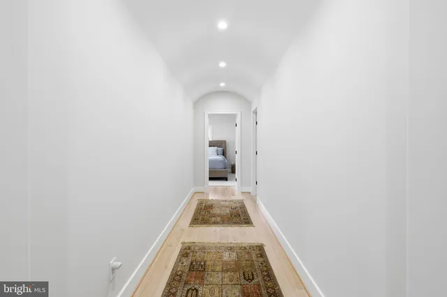 a bedroom with a bed and a table