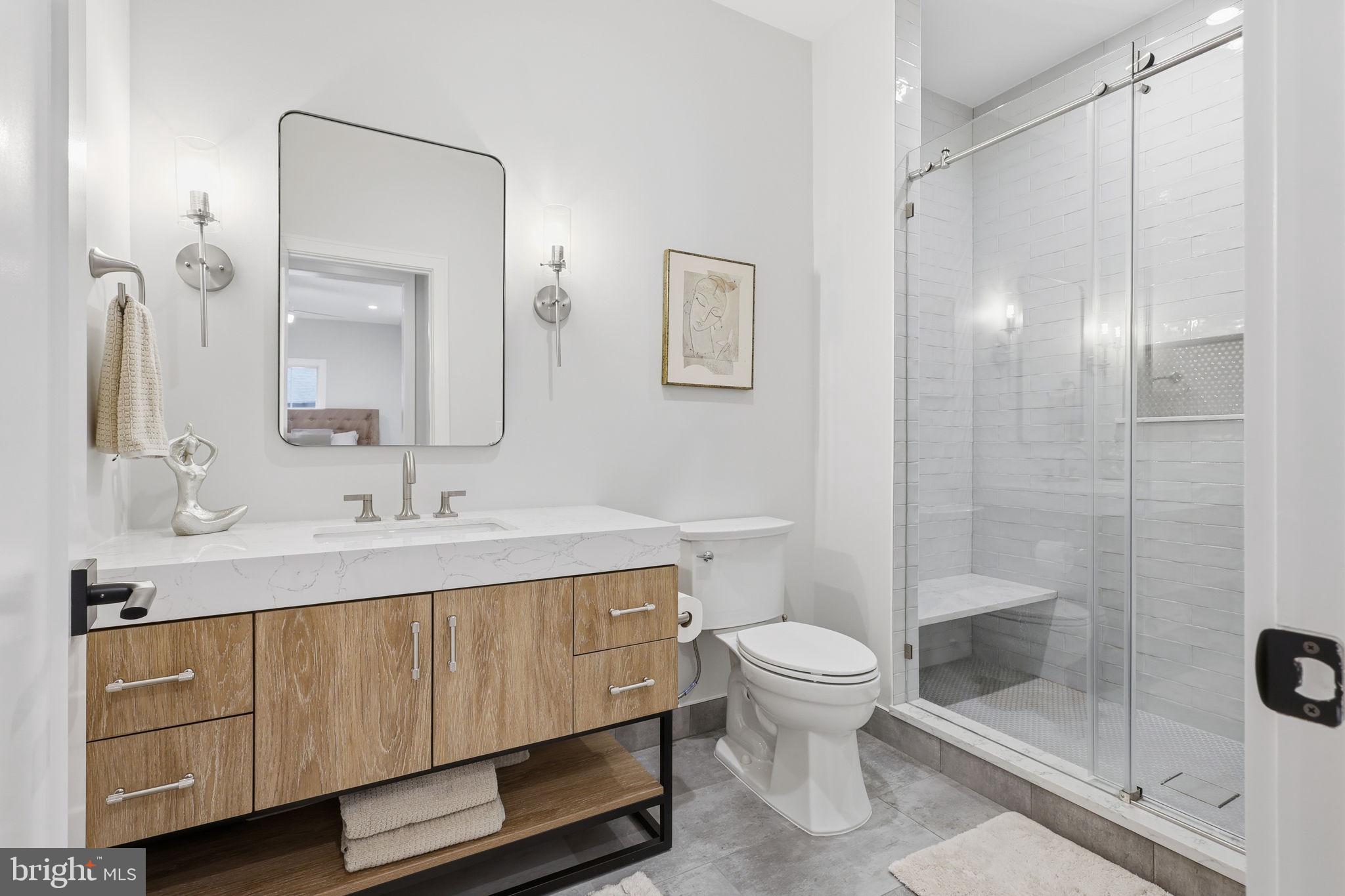 7000 Hector Road McLean, VA 22101 - Photo 29 of 50 a bathroom with a sink a toilet and shower