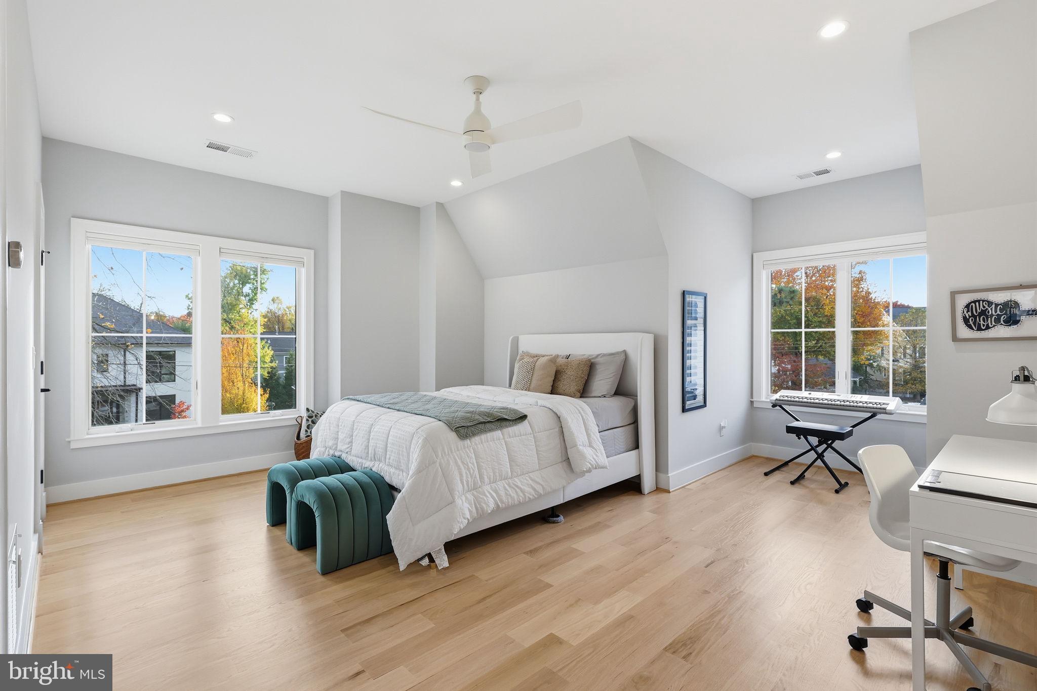7000 Hector Road McLean, VA 22101 - Photo 32 of 50 a spacious bedroom with a bed and wooden floor