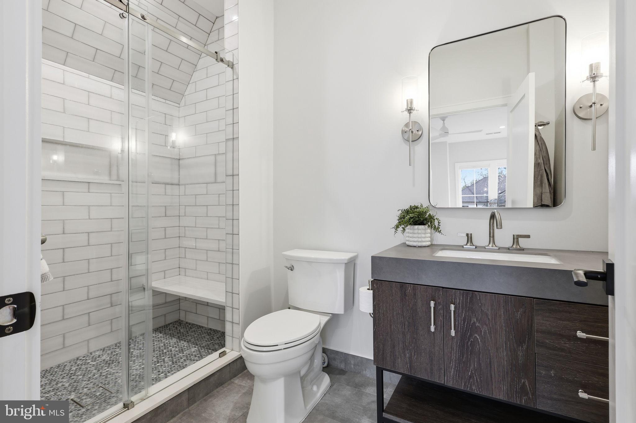7000 Hector Road McLean, VA 22101 - Photo 33 of 50 a bathroom with a sink a toilet and shower