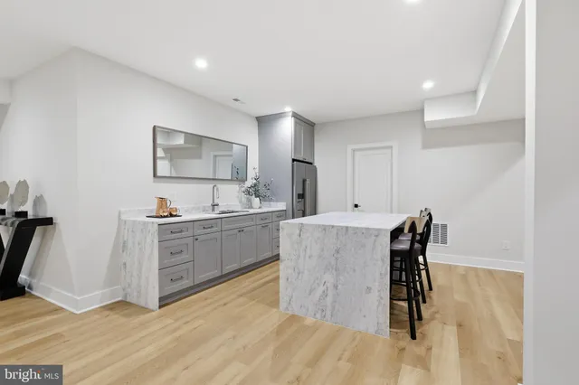 a bathroom with a double vanity sink and mirror