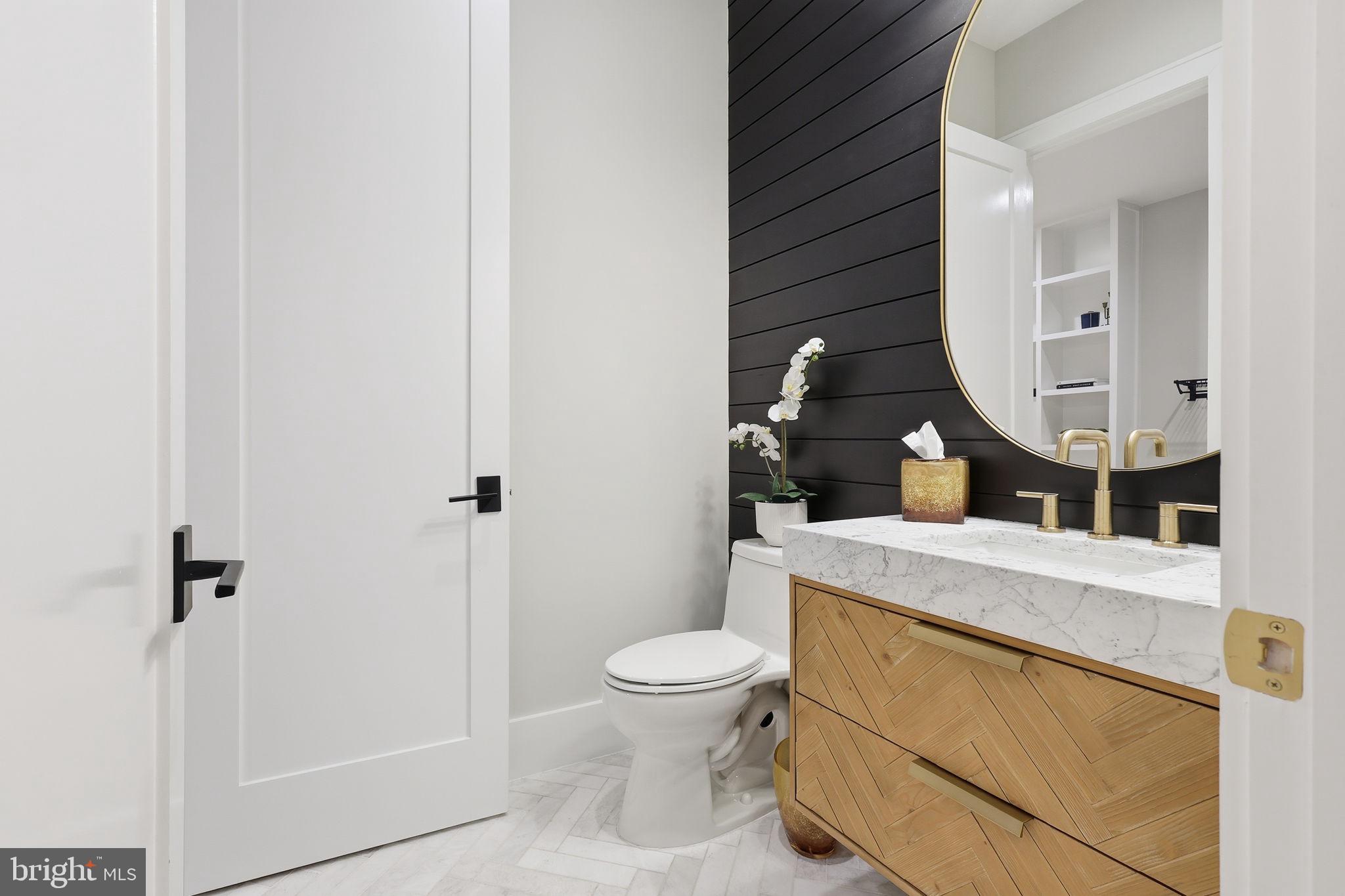 7000 Hector Road McLean, VA 22101 - Photo 44 of 50 a bathroom with a granite countertop sink mirror vanity and toilet