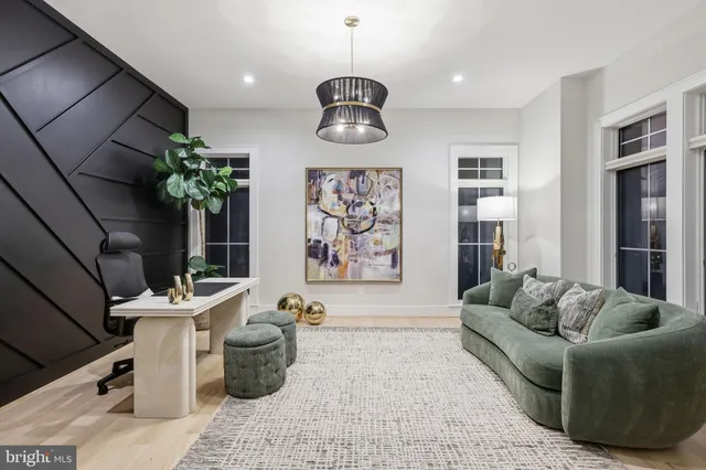 a living room with furniture flowerpot and window