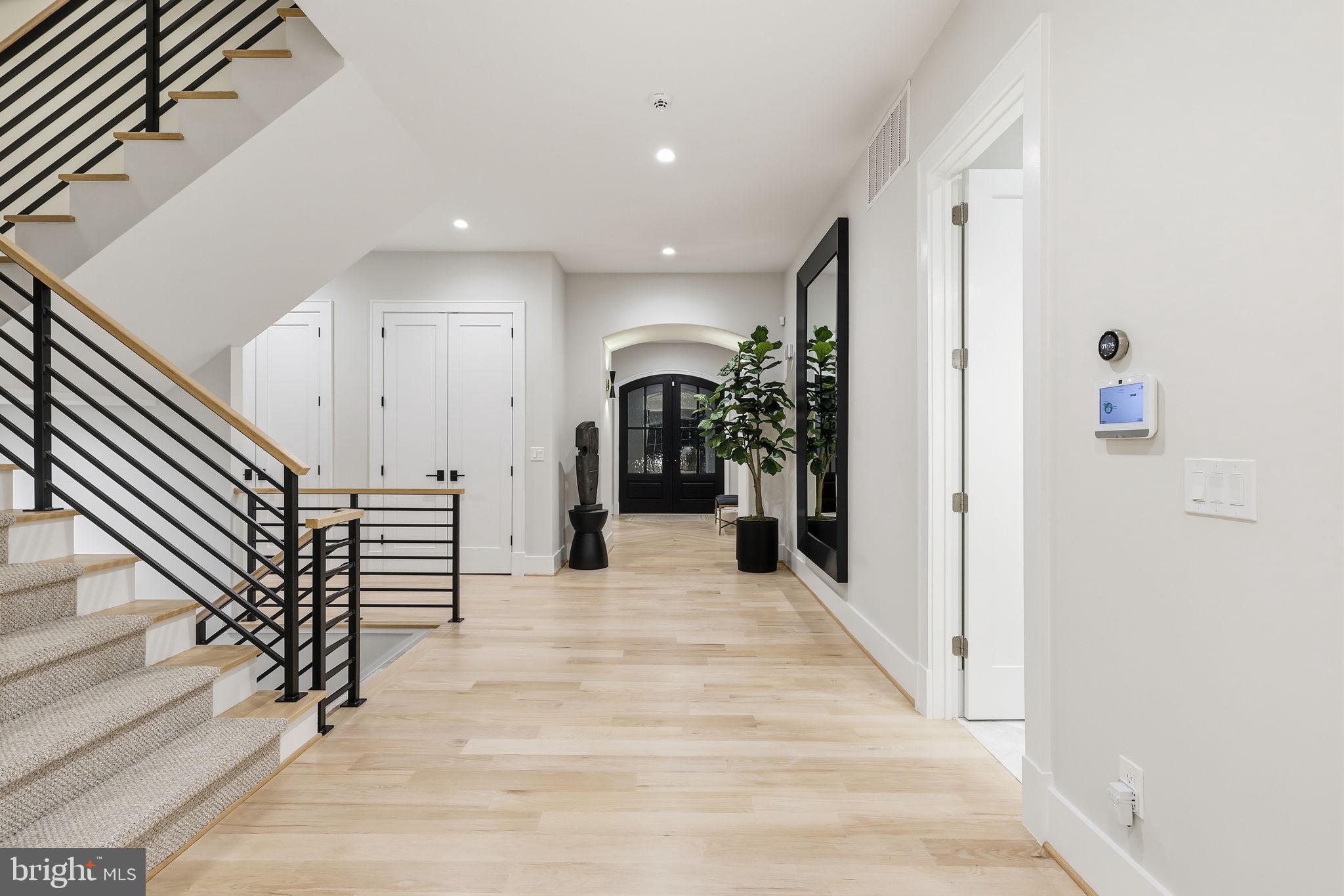 7000 Hector Road McLean, VA 22101 - Photo 8 of 50 a view of a hallway with wooden floor and entryway