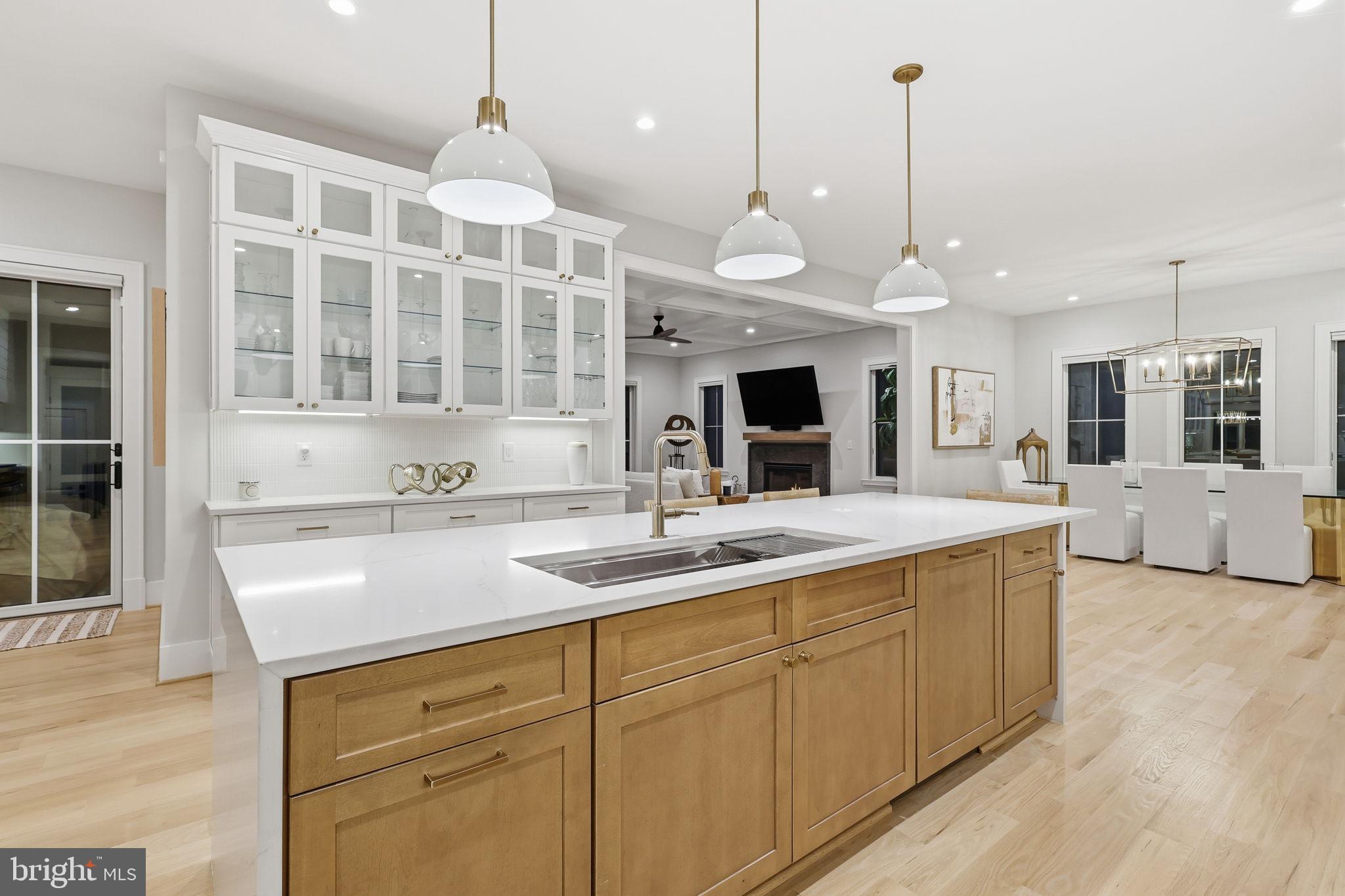 7000 Hector Road McLean, VA 22101 - Photo 9 of 50 a kitchen with stainless steel appliances granite countertop a sink a oven and a wooden floors