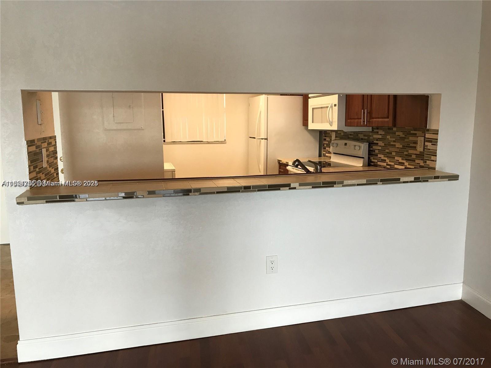 10288 Northwest 9th St Circle, Unit 205 Miami, FL 33172 - Photo 9 of 11 a view of a room with wooden floor