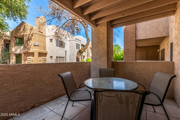 a swimming pool with outdoor seating