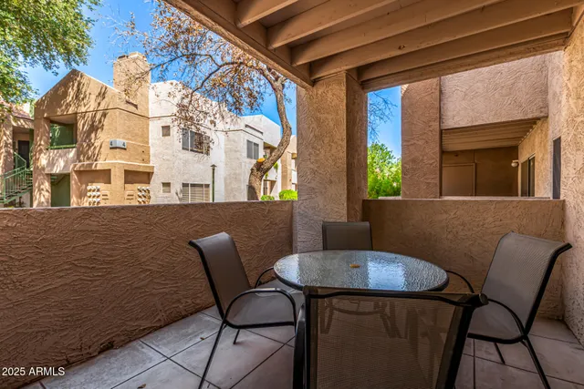 a swimming pool with outdoor seating