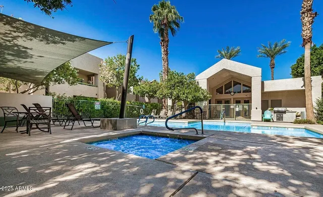 a view of a house with cars park