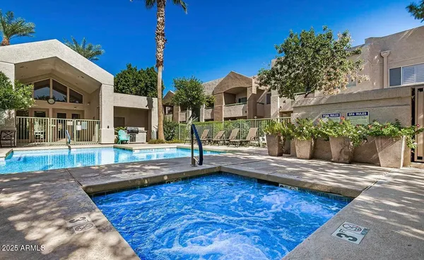 a view of a patio with table and chairs and potted plants