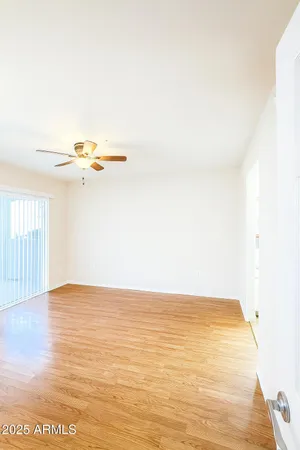a view of a room with wooden floor