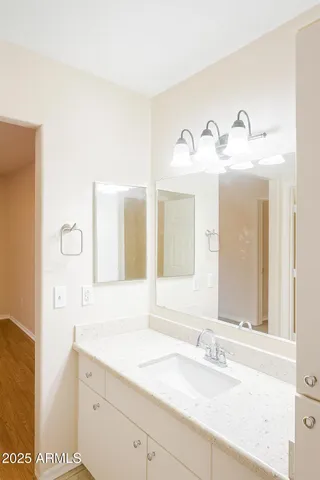 a view of empty room with window and ceiling fan