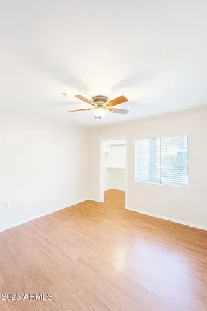 a spacious bathroom with a double vanity sink toilet and a mirror