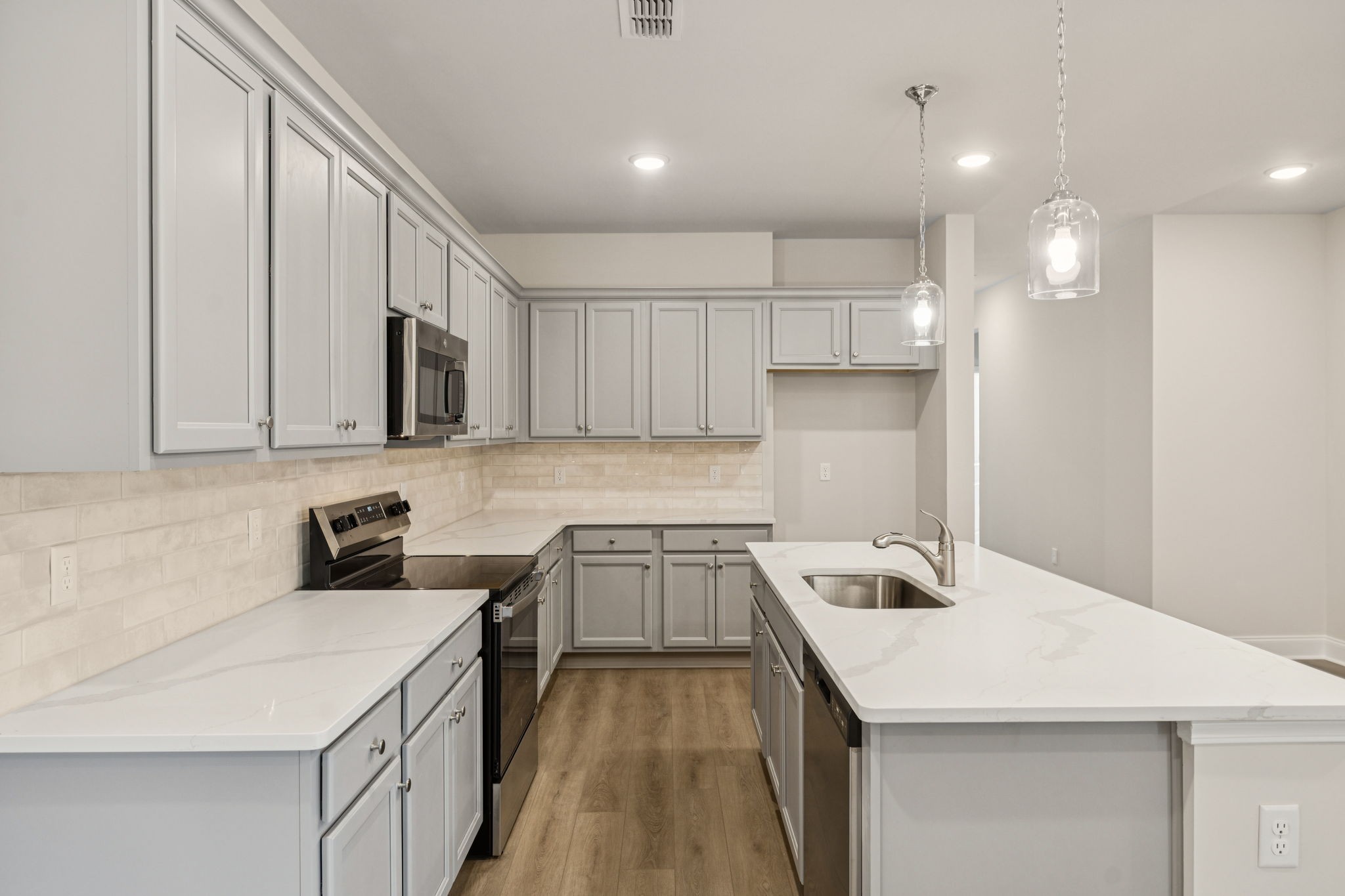 8152 Rocky Fork Almaville Road Smyrna, TN 37167 - Photo 25 of 43 a kitchen that has a sink and a stove in it