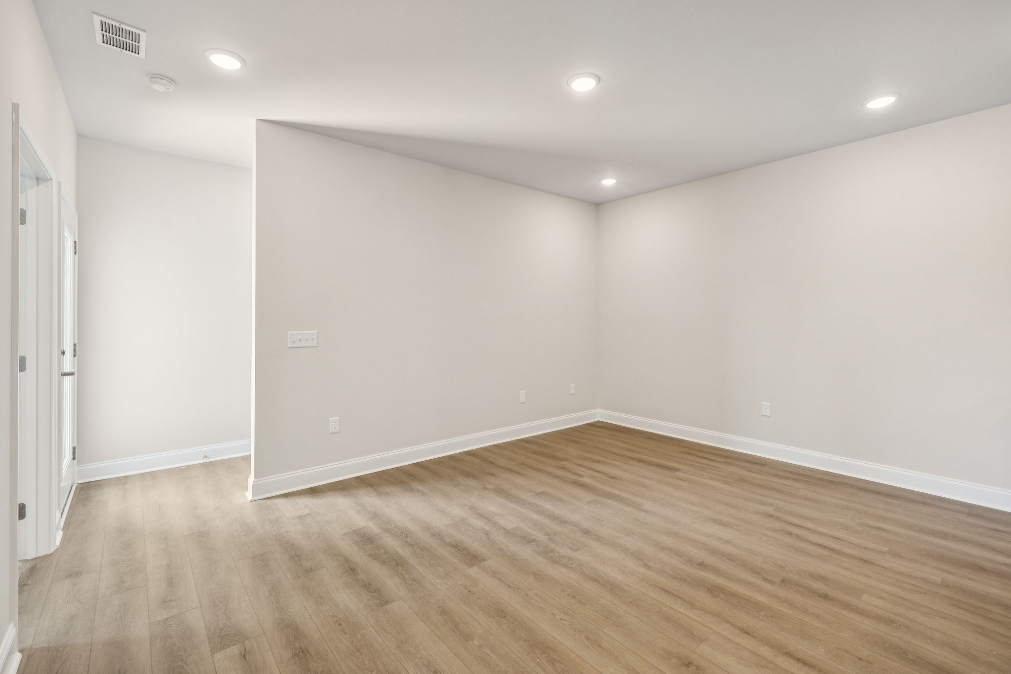 8152 Rocky Fork Almaville Road Smyrna, TN 37167 - Photo 27 of 43 an empty room with wooden floor and windows