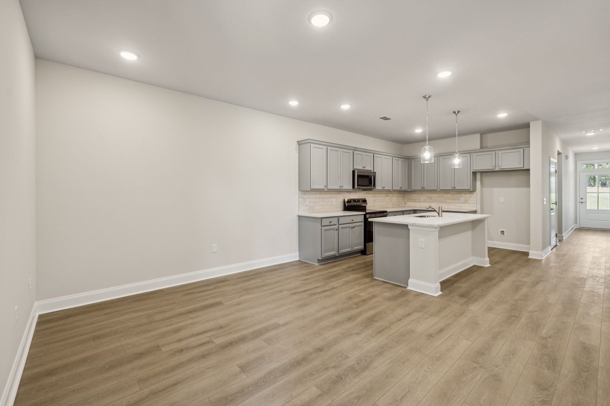 8152 Rocky Fork Almaville Road Smyrna, TN 37167 - Photo 28 of 43 a kitchen with a refrigerator and white cabinets